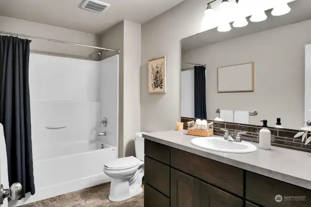 The main level full bath serves your guests and the 2 bedrooms on this level.