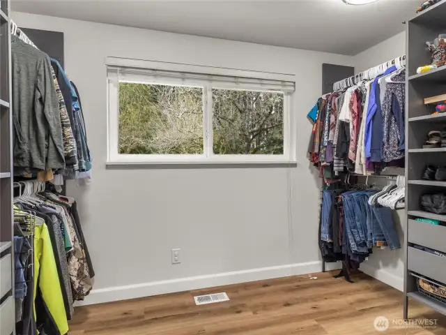 An oversized walk-in closet attached to the primary bedroom.