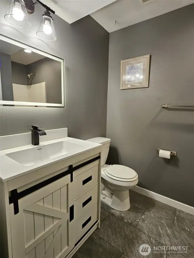 downstairs bathroom with shower.