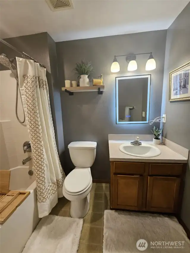 Upstairs bathroom with bathtub.