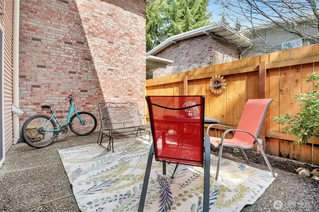 Step-out onto the patio to enjoy the sun and a morning coffee or dig-in-the-dirt to create your own garden.