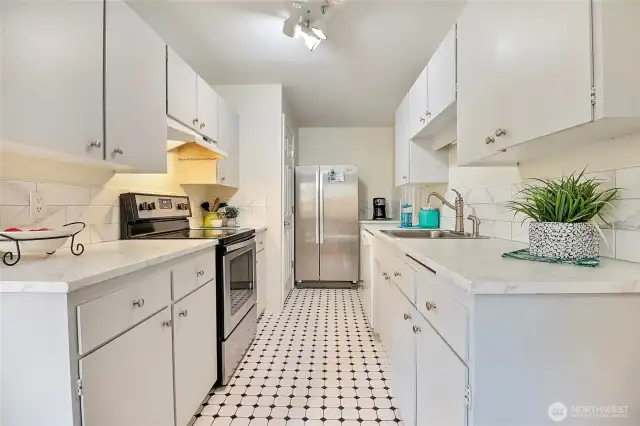 Newer stainless steel refrigerator and stove.