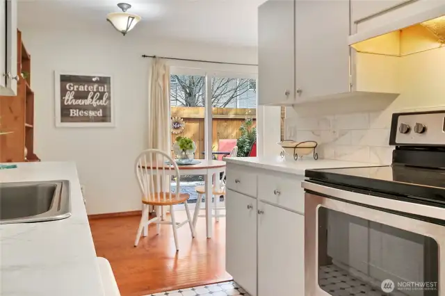 Adjacent to the kitchen is direct access to a separate storage locker and community laundry.