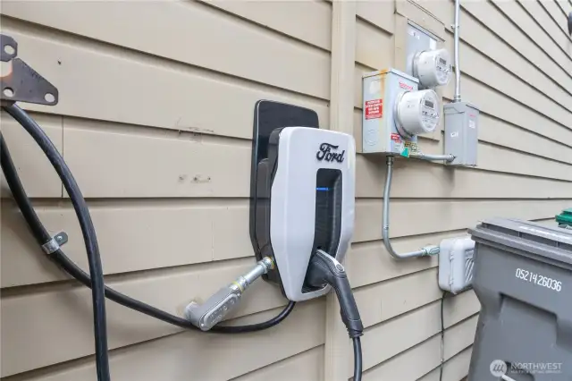 High power 3rd electric  charging station on side of home
