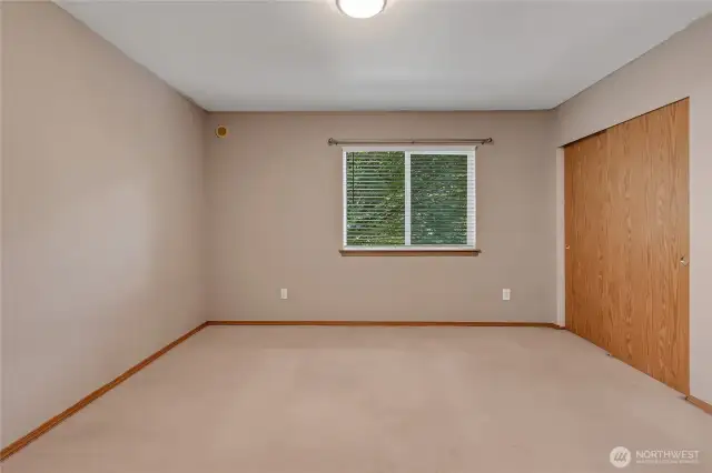 Generously sized primary bedroom with great closet space and soft natural light to start your mornings right.
