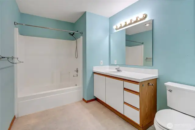 Spacious bathroom with a full-size tub/shower combo and great vanity storage for all your daily needs.