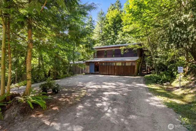 2 car garage with workshop space and ADU above.