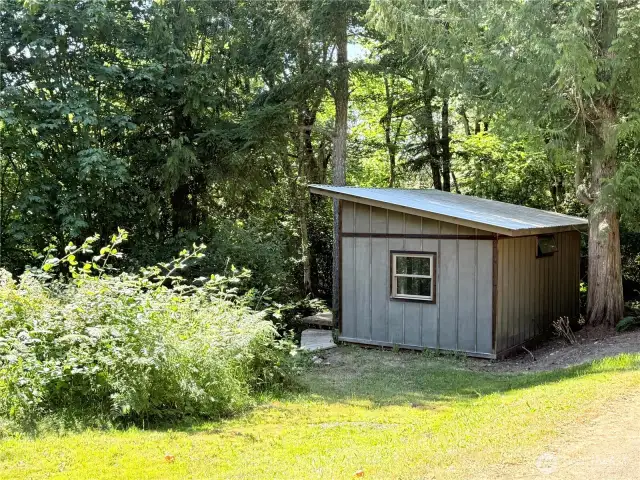 Outbuilding #1. 12x24, unfinished cabin, currenlty housing a ping pong table- easily converted to a very nice studio