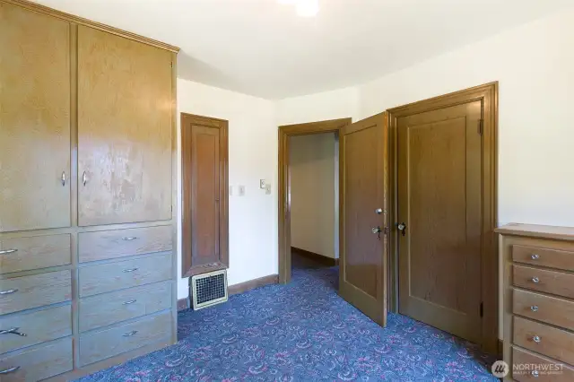 Built in armoire, ironing board and dresser! You don't find this often, beautifully preserved!