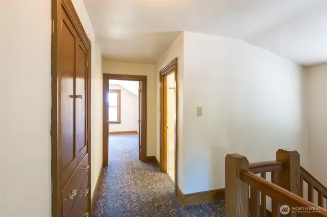 Upstairs hallway, with beautiful wood banister.