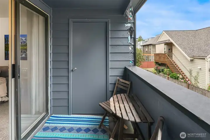 Balcony off of living room with large storage closet.