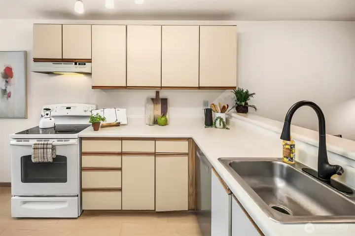 Kitchen offers an abundance of storage and new LVP floors.