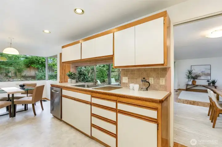 The spacious kitchen features plenty of counter and cupboard space.