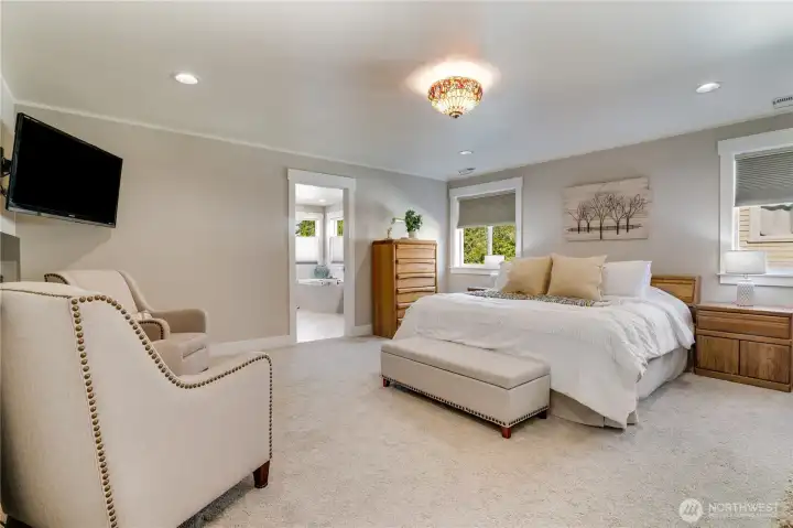 Welcome to your spacious primary bedroom