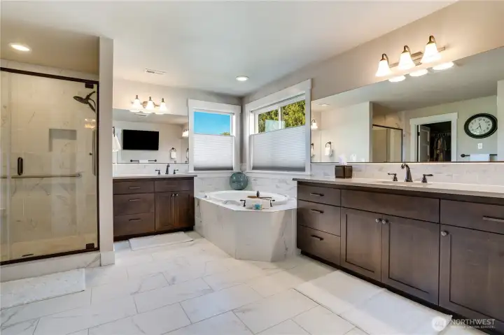 Spa-like primary bath with heated tile floors