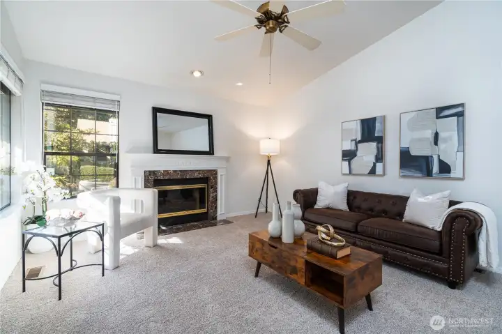 Vaulted ceilings in living room with new carpet and paint