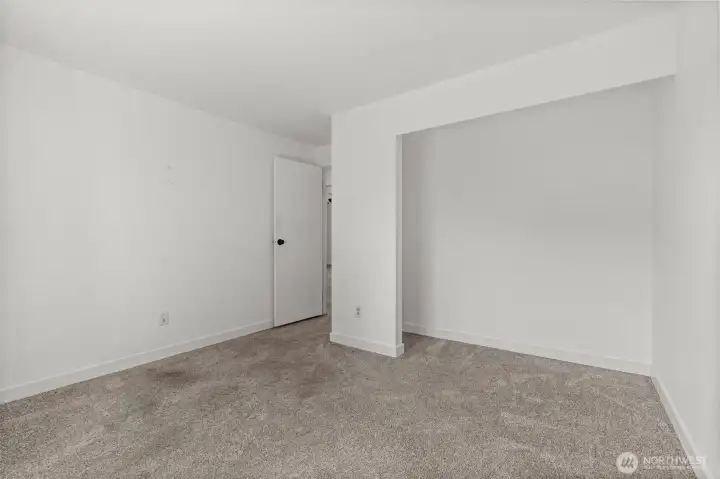 A second bedroom on the main floor offers easy access to the main-floor bathroom and enjoys views of the backyard.