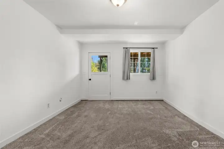 The last room in the house opens directly to the backyard, providing the perfect setting for a home office, media room, or flexible living space to fit your needs.