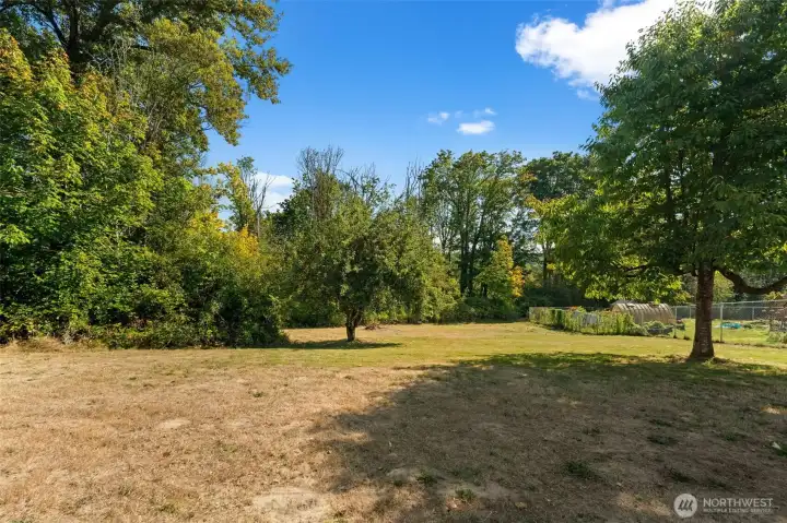 Enjoy a spacious backyard with convenient side access — perfect for pulling in a trailer, boat, or RV, or taking on your next big project. With mature fruit trees and a lot larger than most in the neighborhood, this outdoor space truly stands out.