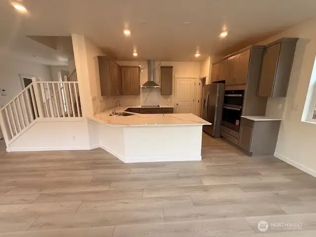 Upgraded Gourmet Kitchen Selections w/upgraded quartz backsplash and countertops