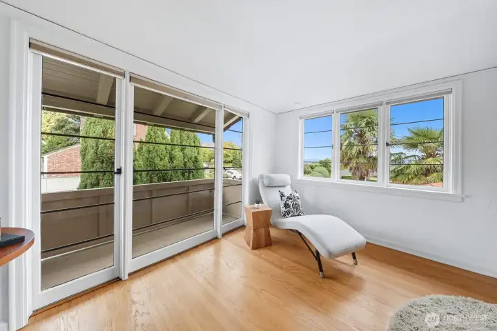 View of the Juliet balcony in the primary bedroom.  Such a lovely spot to enjoy a morning coffee or evening beverage. You can also catch views of the lake from this room!