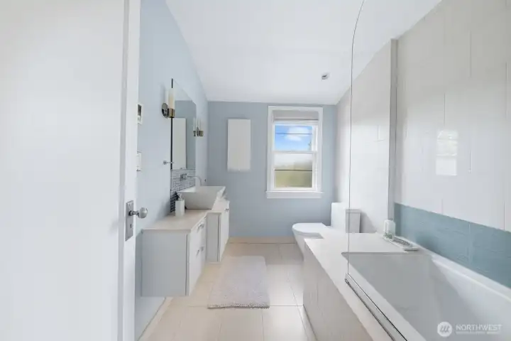 Second bathroom upstairs with high-end Jacuzzi tub.