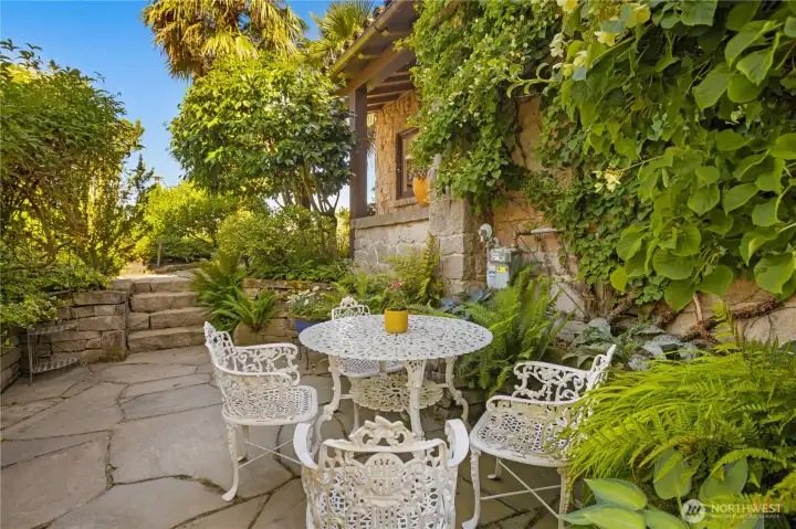 A side patio by the front door is a perfect spot to admire your garden.