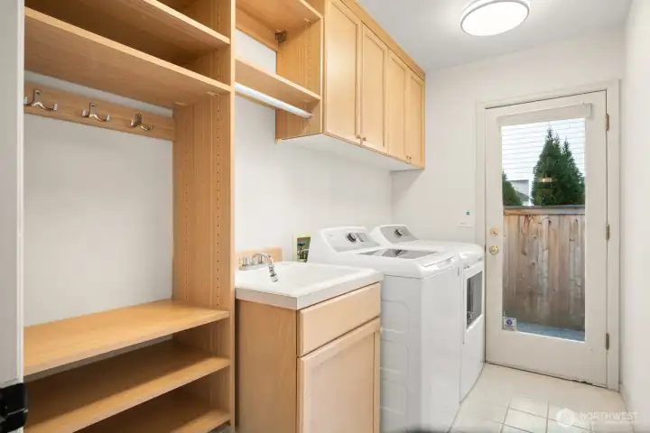 Laundry/mudroom with built-in cabinets on lower level