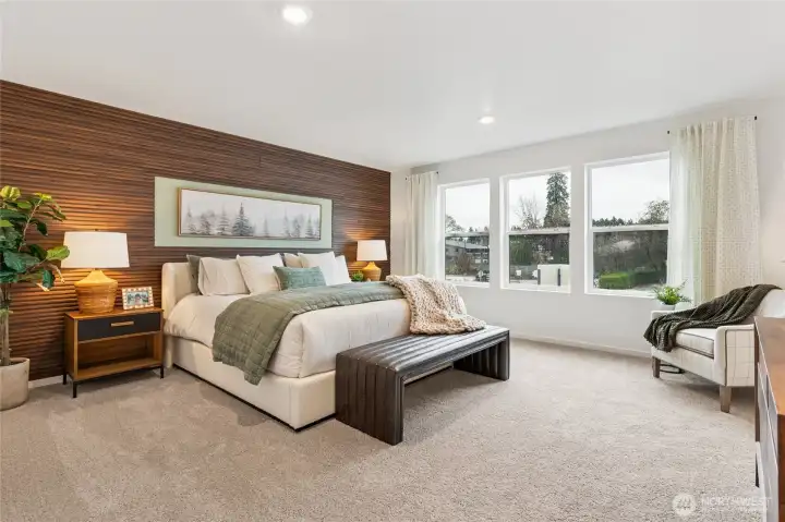 Huge primary bedroom suite with 3 large windows for light. Actual home is under construction and finishes, materials, and colors will vary. See site agent for details.