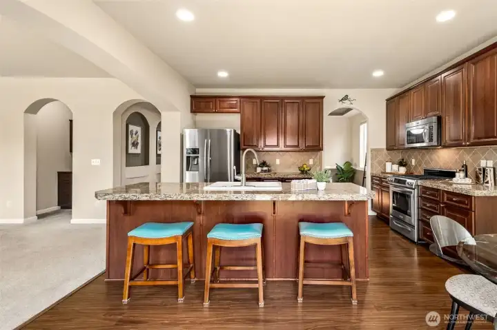 The center island with bar seating is so perfectly located