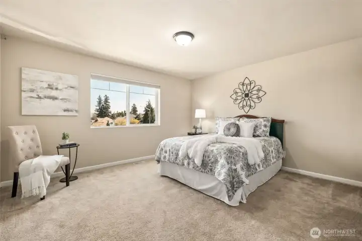 One of two spacious front bedrooms featuring beautiful views and generous closet space.