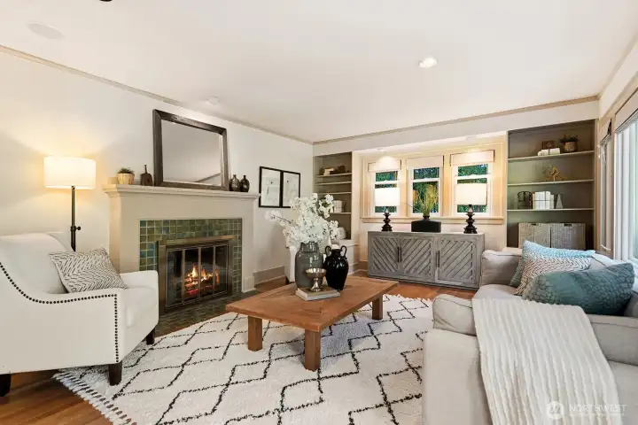 Living room with a wood burning fireplace.