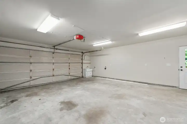 Garage interior with plenty of work and storage space.