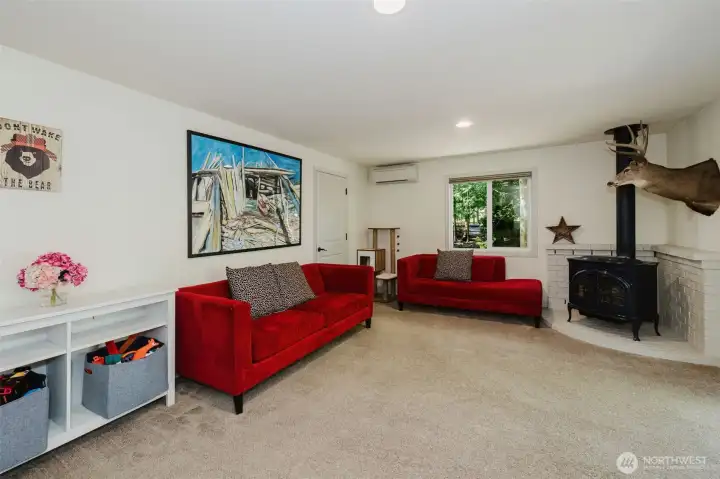 Family room with free-standing gas stove.