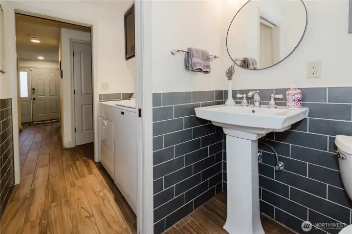 Main level half bath and utility room.