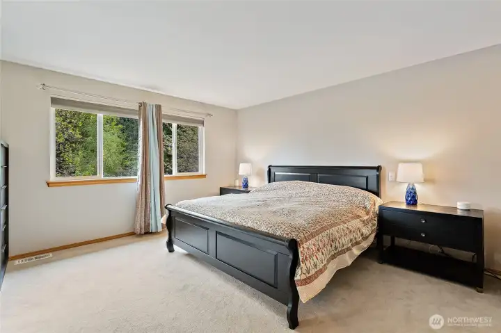 Primary bedroom with two walk in closets