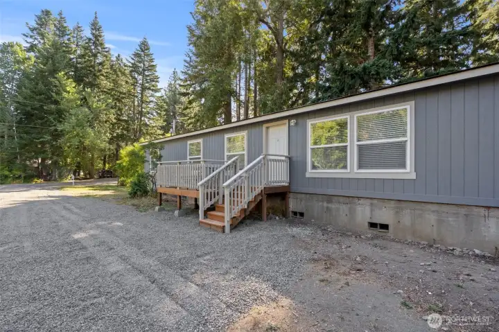 Deck and large gravel driveway