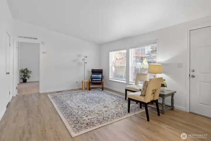 Front entrance living area looking into primary bedroom/bath