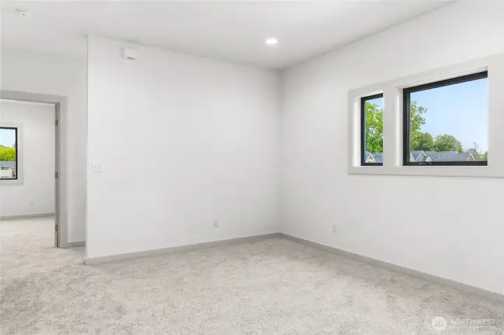 Family room flanked by 3 bedrooms on upper level. Family room flanked by 3 bedrooms on upper level.