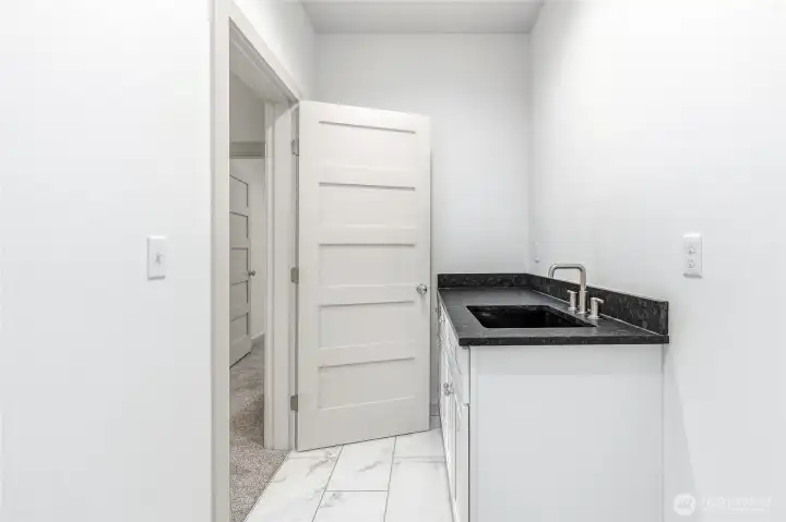 Laundry room conveniently located between bedrooms on upper level. Laundry room conveniently located between bedrooms on upper level.