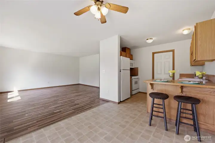 Looking from dining area to kitchen and living room