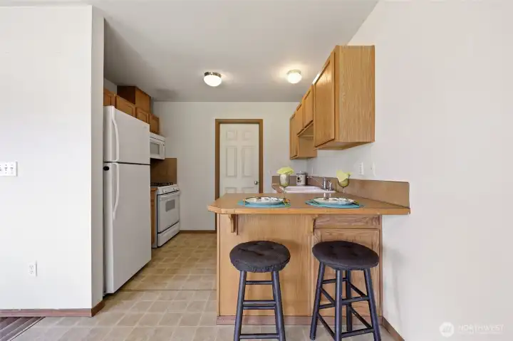 Kitchen with door leading to laundry, pantry and garage