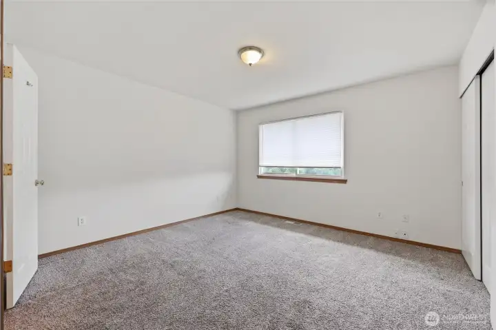 Primary bedroom with bathroom and dbl closets