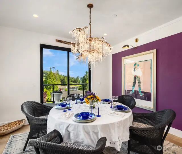 The dining room features this stunning rain chandelier over your table that offers a water view.