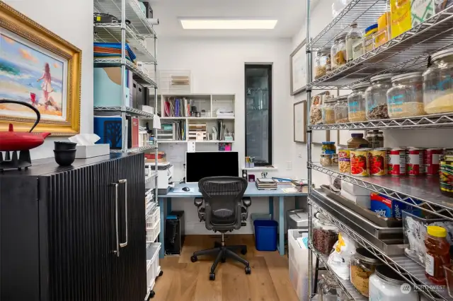 Adjacent to the kitchen, you'll find a convenient pantry and built-in office, making it a breeze to look up your favorite recipes and stay organized.