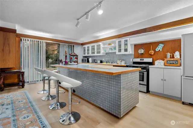 This kitchen includes a huge breakfast bar for added seating!