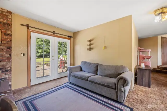 Living area with french doors onto back patio