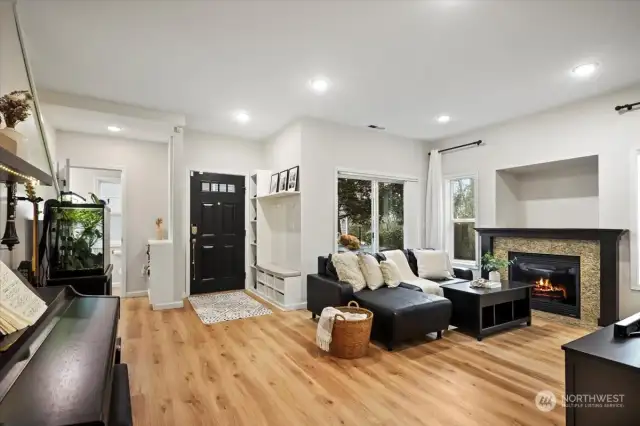 Living room area with fireplace and sliding door access to 1st patio