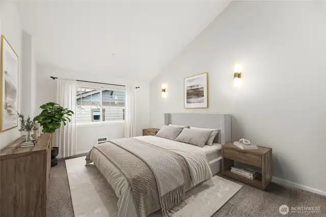 Oversized bedroom with vaulted ceilings.