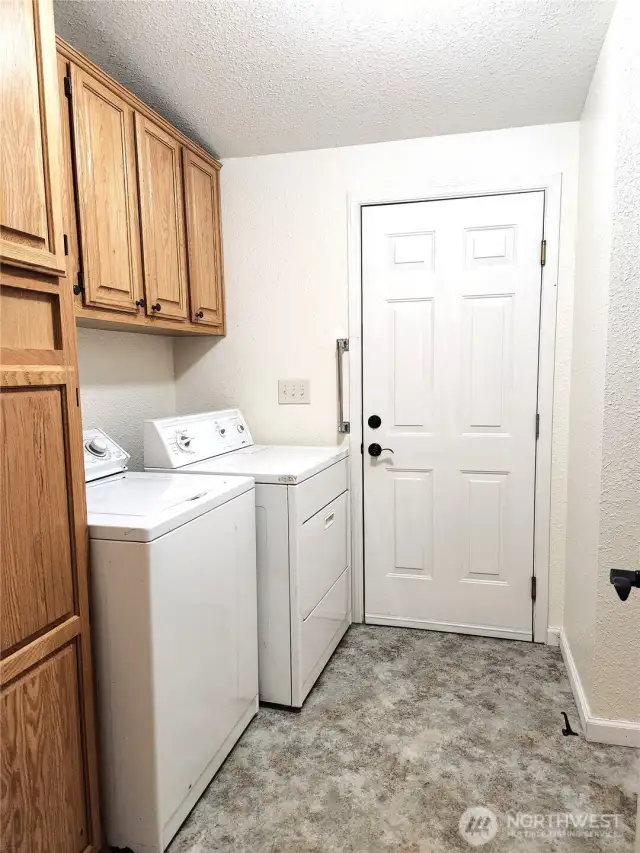 Utility area with closet